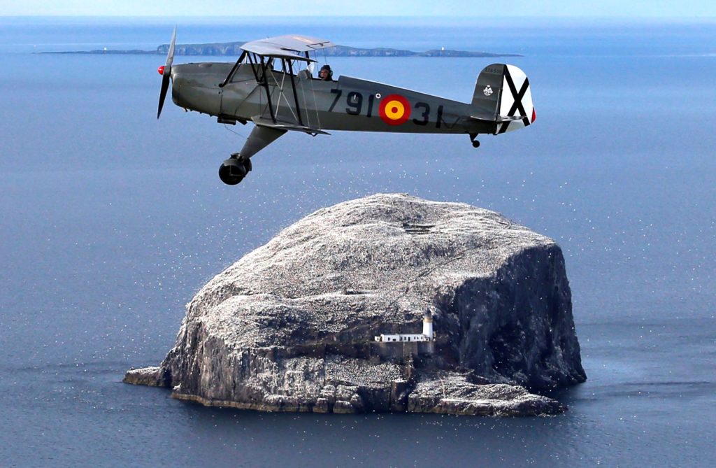 Bucker Jungmann pilot Gavin Hunter takes a practice flight over the Bass Rock off the East Lothian coast ahead of his appearance at Scotland's National Airshow at East Fortune, East Lothian (19.07.16) Bucker Jungmann pilot Gavin Hunter takes a practice flight over the Bass Rock off the East Lothian coast ahead of his appearance at Scotland's National Airshow at East Fortune, East Lothian (19.07.16)