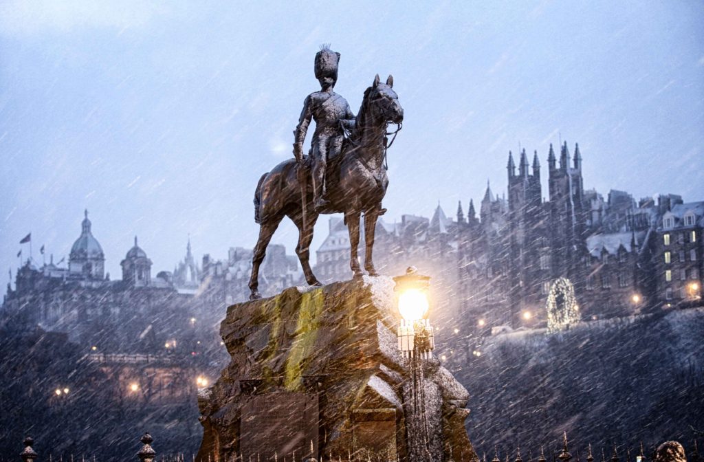 's Princes Street gets a covering of snow on Boxing Day morning (26.12.16) The Royal Scots Greys Monument on Edinburgh's Princes Street gets a covering of snow on Boxing Day morning (26.12.16)